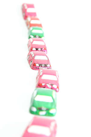little chocolates in shape of car isolated on whiteの写真素材
