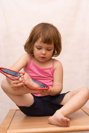 little cute girl and funny, heart shaped, sunglassesの写真素材