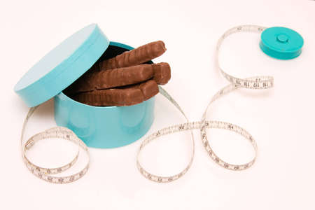 dieting - no chocolates, please! composition on whiteの写真素材