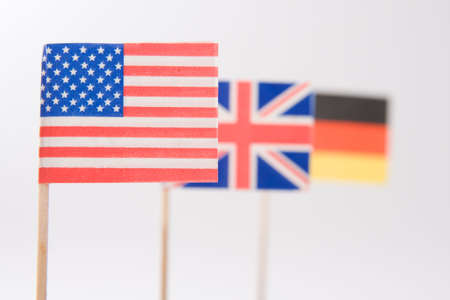 American, German and British flags on light tone backgroundの写真素材