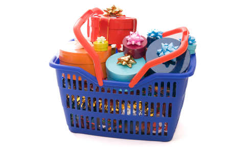 blue basket full of Christmas gifts isolated on whiteの写真素材