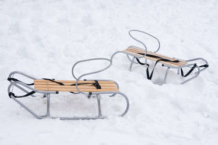 two sledges left in the snowの写真素材