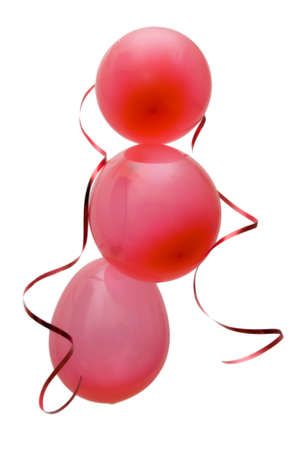 red party balloons decorated with ribbons isolated on whiteの写真素材