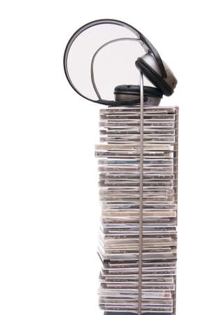 compact disc rack with headphones isolated on whiteの写真素材