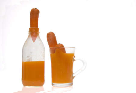 carrots and carrot juice isolated on whiteの写真素材