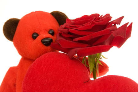 Valentines teddy bear, red rose and heart isolated on white