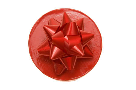 red gift box with a bow isolated on whiteの写真素材