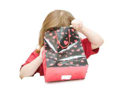 happy kid with gift bag, hearts patternの写真素材