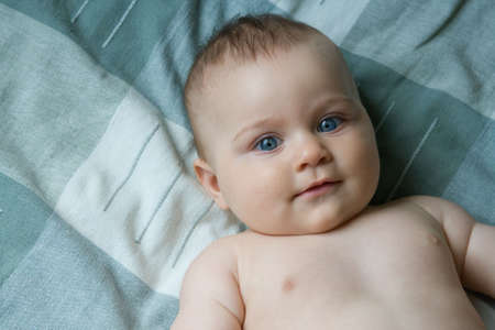 little, cute baby boy smilng happilyの写真素材