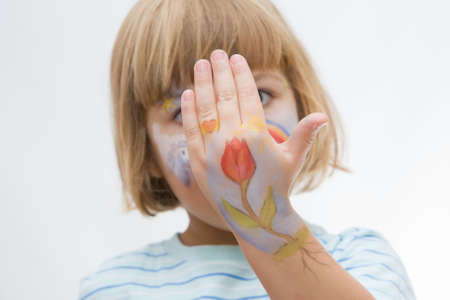 lovely, happy little  girl with painted faceの写真素材