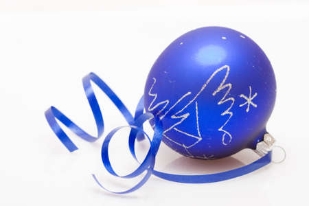Christmas bauble and dancing ribbon isolated on whiteの写真素材