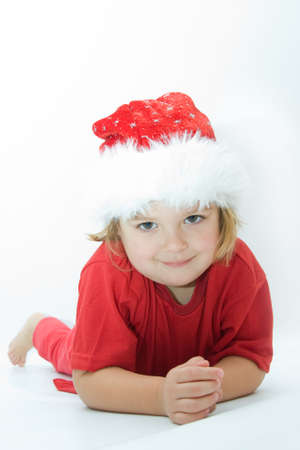 Christmas kid in Santa hat on white background
