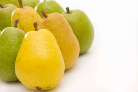yellow and green pears on white with copy spaceの写真素材