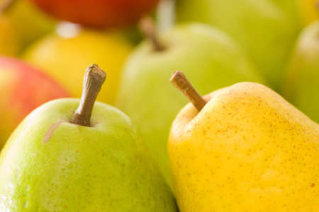 close up of pears on fruity colors background