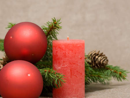 Christmas decoration made of conifer and candlesの写真素材