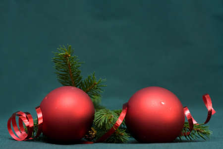 Christmas composition of conifer, red baubles and ribbonの写真素材
