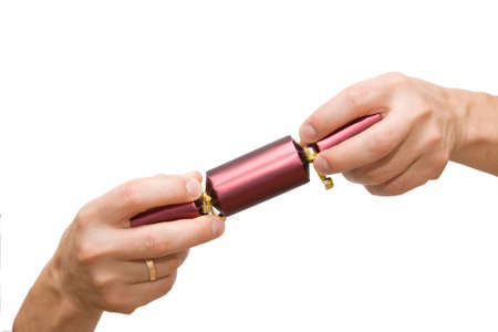 man's hand holding Christmas crackers, on whiteの写真素材