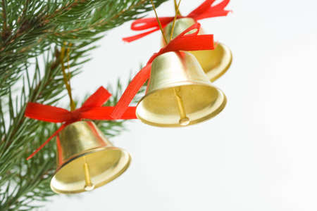 Christmas decoration - little golden bells and spruceの写真素材