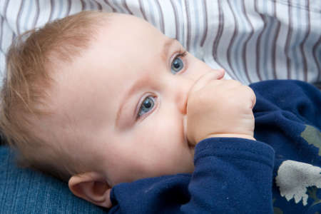 little baby boy sucking his thumb, close up