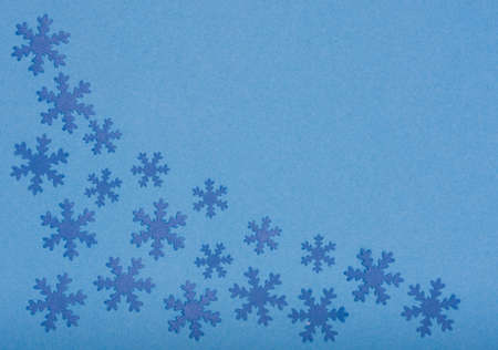 winter background - composition of snowfaleks on blueの写真素材