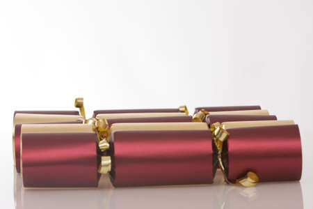 lot of Christmas crackers, golden and redの写真素材