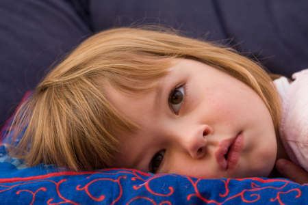 little, cute girl just about to fall asleep