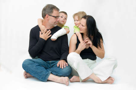 happy family of four, parent with two sons