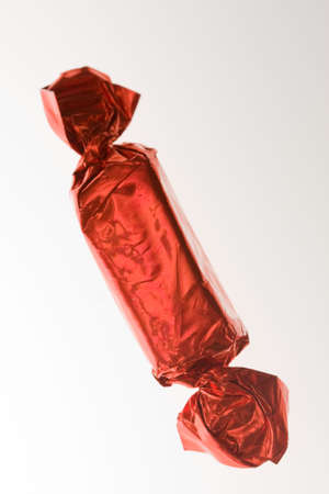 chocolate candy in colorful wrapping on whiteの写真素材