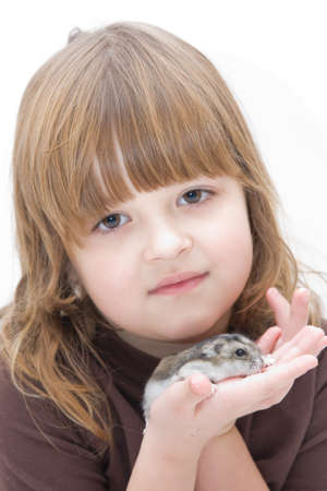 cute, beautiful girl with her little hamsterの写真素材
