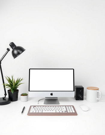 workplace with computer, lamp, coffee cup and plant on white background