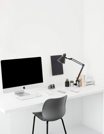 workplace with computer, lamp and stationery in a modern officeの写真素材