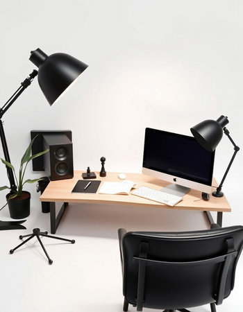 Workplace with computer, lamp and plants on table in modern office