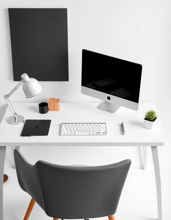 Modern workplace with computer, lamp and stationery on white wall background