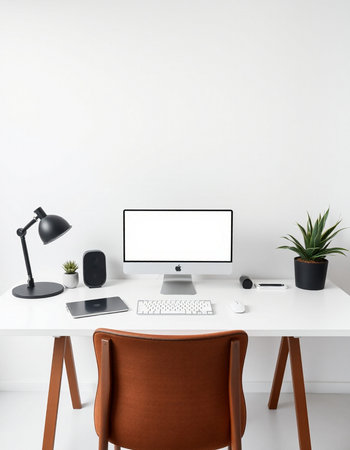workplace with computer, lamp, tablet and plant on white background