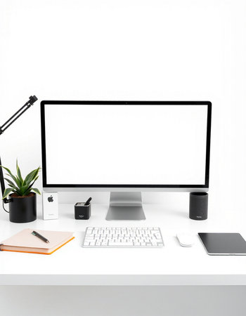 Modern workspace with blank computer screen, stationery and decorations on white table