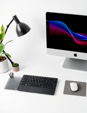 Modern workspace with computer, keyboard, mouse and coffee cup on white background