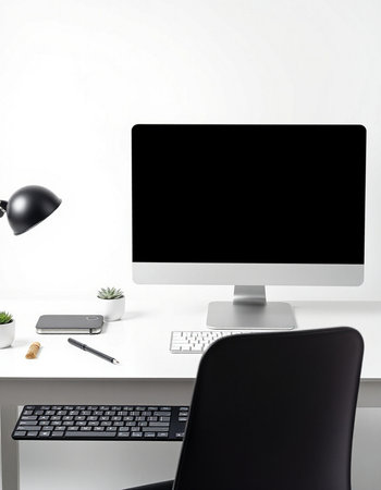 workplace with computer, keyboard, mouse, pencil and plant on table