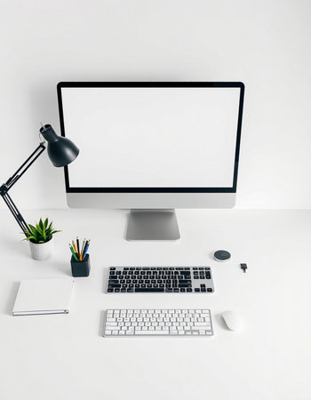 Workplace with computer, keyboard, mouse and stationery on white table