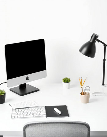 Modern workplace with computer, keyboard, mouse, lamp and other items