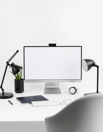 Modern workspace with blank screen computer monitor, keyboard, mouse, coffee cup and other items on...