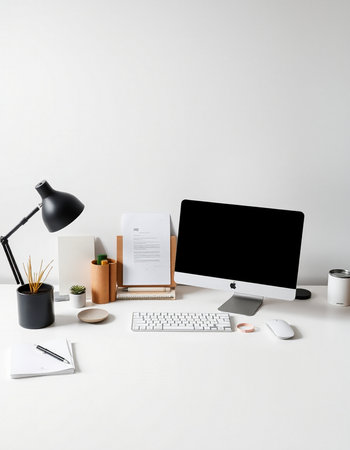 workplace with computer, stationery and coffee cup on white background