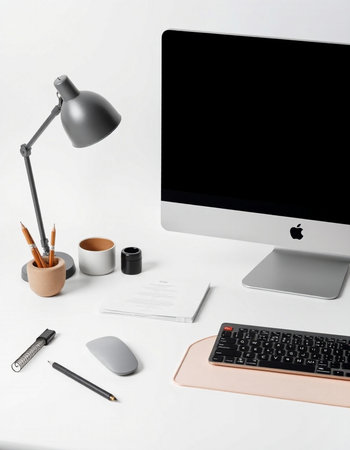 Modern workplace with computer, lamp and stationery isolated on white background