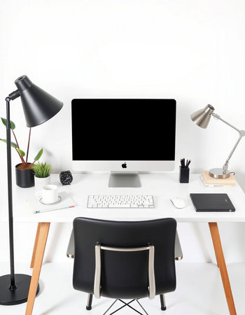 workplace with computer, lamp and coffee cup in modern office interior