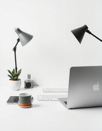 Modern workplace with laptop, coffee cup and other items on white background