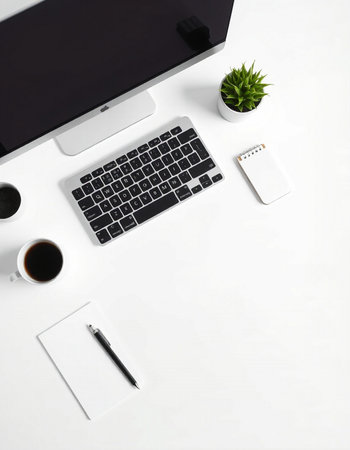 White office desk table with computer, supplies and coffee cup. Top view with copy space, flat layの写真素材