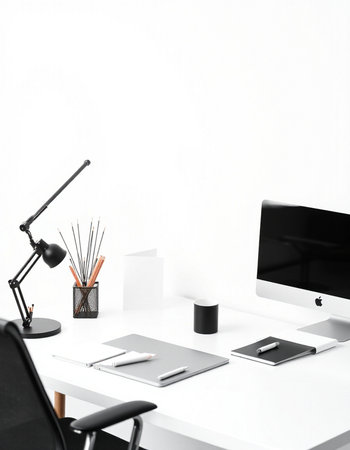 Modern workplace with computer, stationery and coffee cup on white backgroundの写真素材
