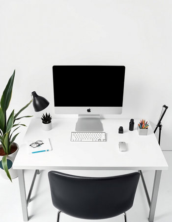 workplace with computer, stationery and green plant isolated on whiteの写真素材