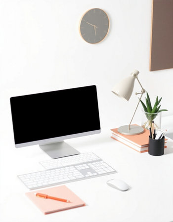 Modern workspace with computer, stationery and clock on white background.の写真素材