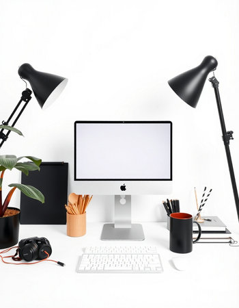 Modern workplace with computer, lamp and stationery on white background.の写真素材