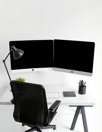 Modern workplace with computer and black chair on white background. 3D rendering.の写真素材
